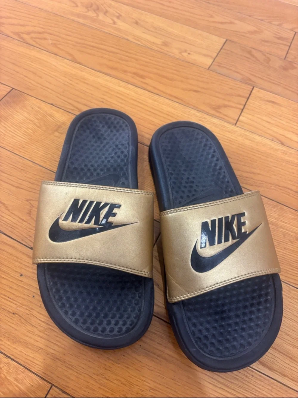 Nike Black and Gold Slide Sandals, women’s size 6